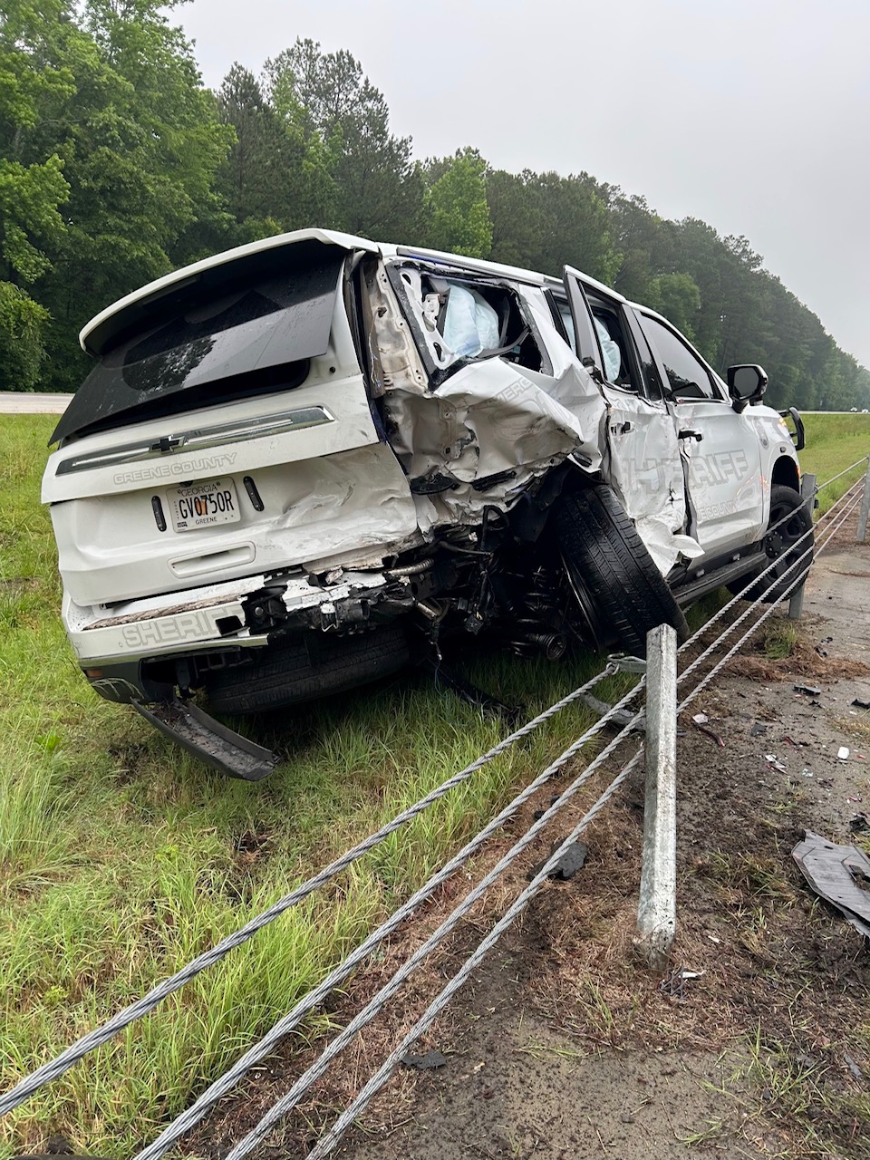 Authorities say the driver of this luxury car was responsible for the crash that injured a woman and two deputies with the Greene County Sheriff’s Office Sunday morning on I-20 in Greene County.